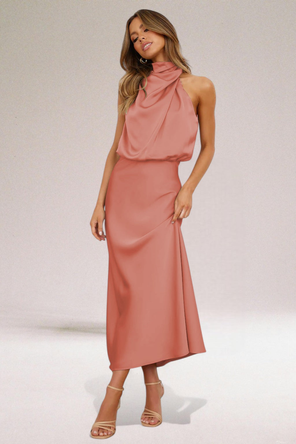 Elegant black halter neck dress with sleek silhouette and radiant finish for special occasions