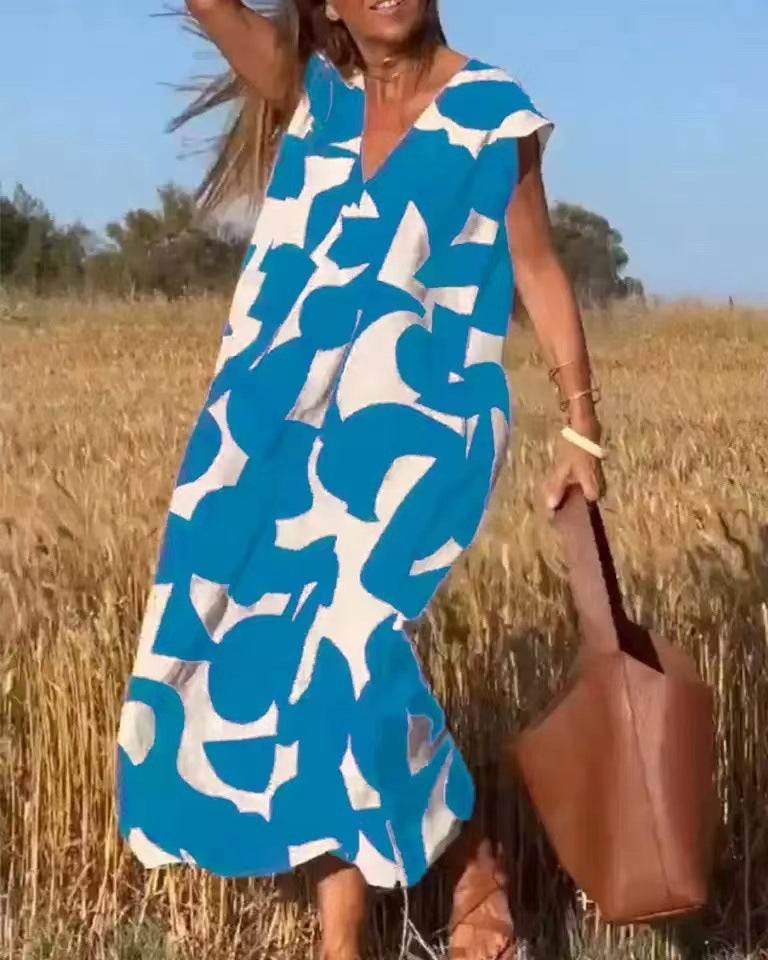 Women's flowy maxi dress with lace details and bold abstract print in a relaxed sophisticated silhouette