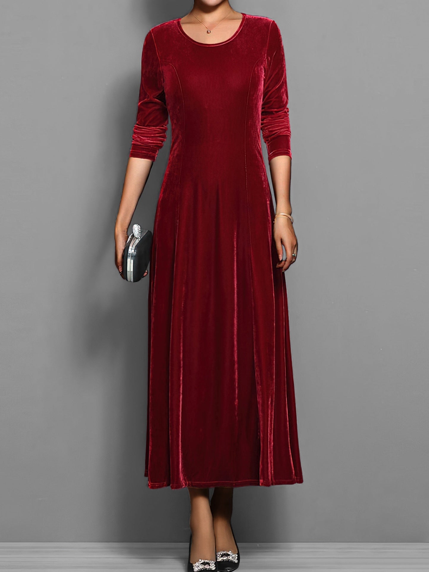 Soft velvet midi dress in rich jewel tone with elegant drape and luxurious textured fabric