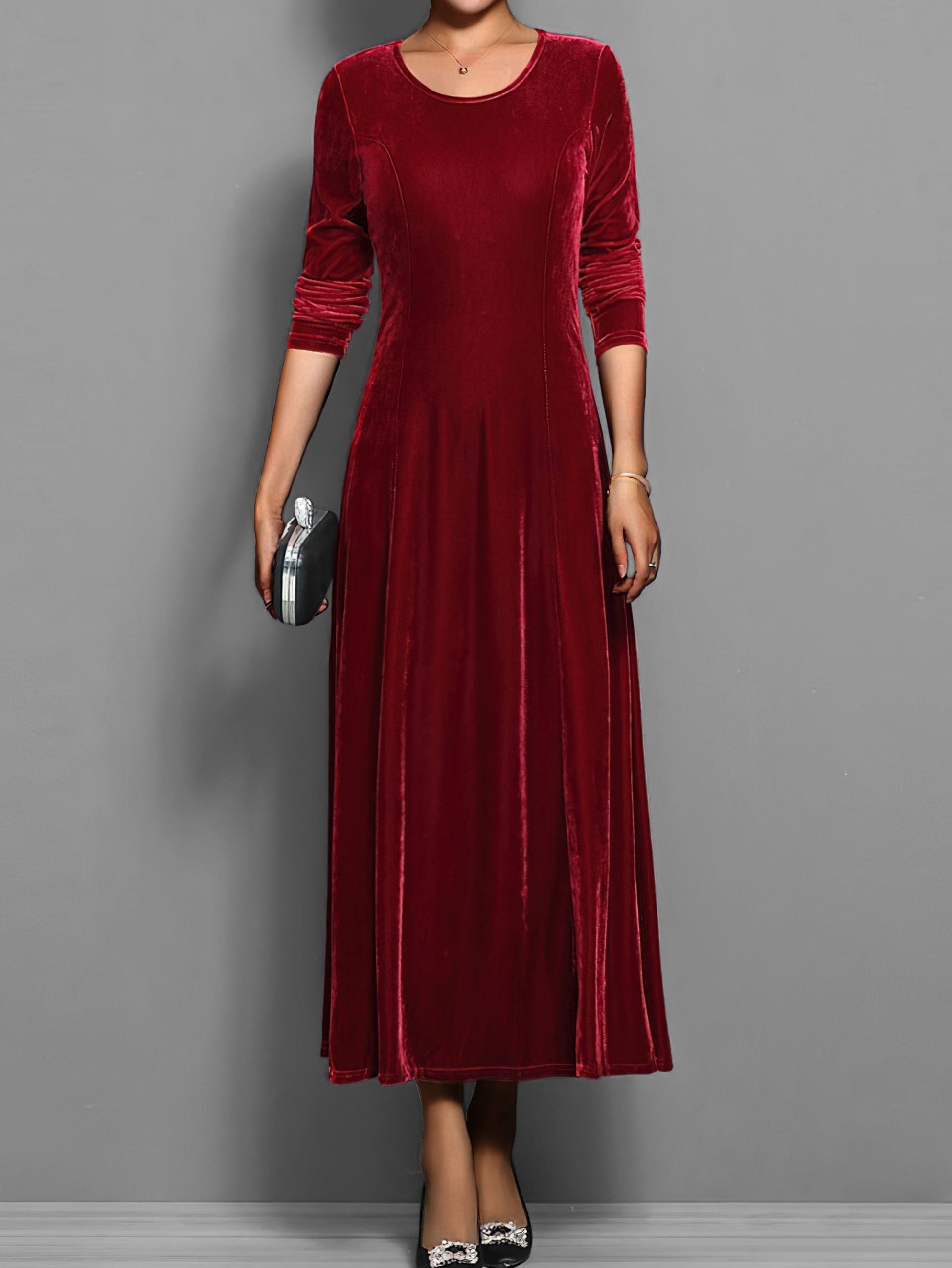 Soft velvet midi dress in rich jewel tone with elegant drape and luxurious textured fabric