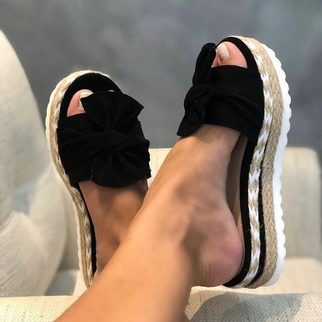 Women's woven wedge sandals with bow detail for feminine everyday elegance and all-day comfort