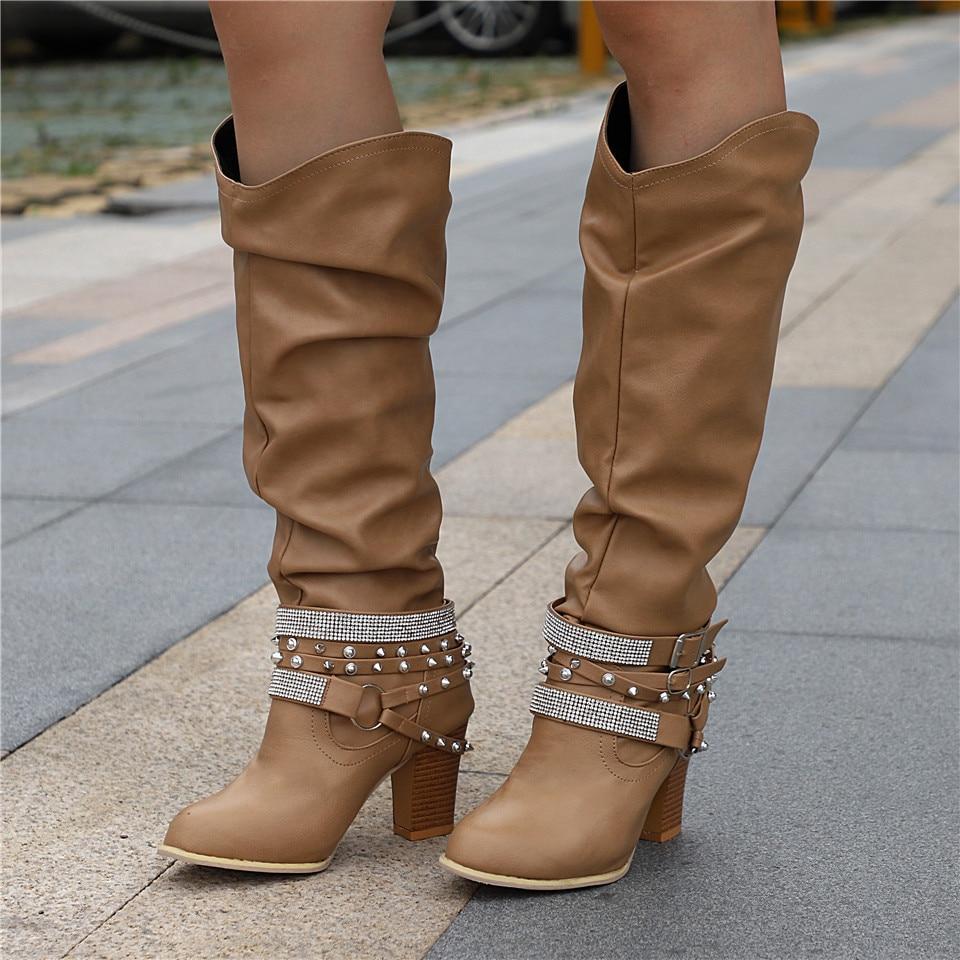 Women's black slouchy knee-high boots with block heel, relaxed fit leg-lengthening silhouette