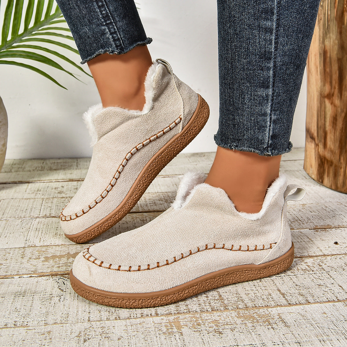 Warm fur-lined slip-on ankle boots with thick anti-slip sole, sleek silhouette, neutral tone