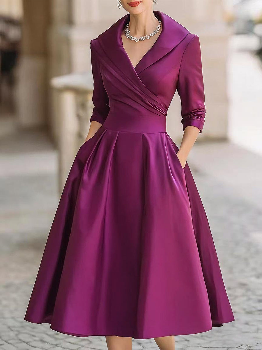 Elegant satin midi dress with fluid drape and luxurious light-catching finish for special occasions