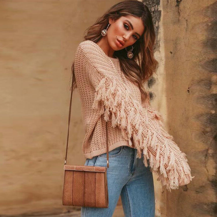 Women's cream chunky knit relaxed sweatshirt with ribbed texture and playful fringe sleeves