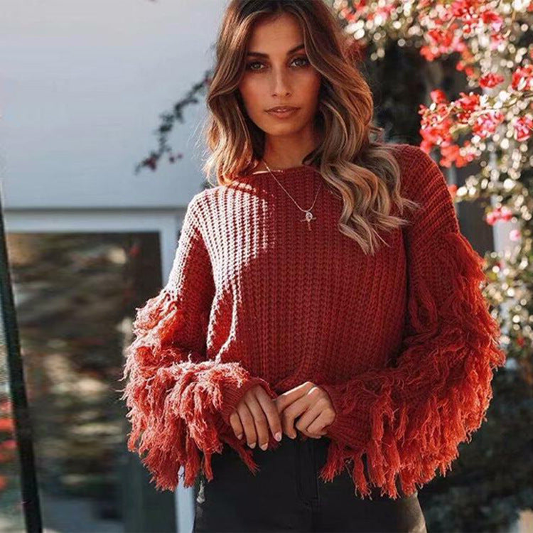Women's relaxed fit chunky knit sweatshirt with ribbed texture and fringe sleeves
