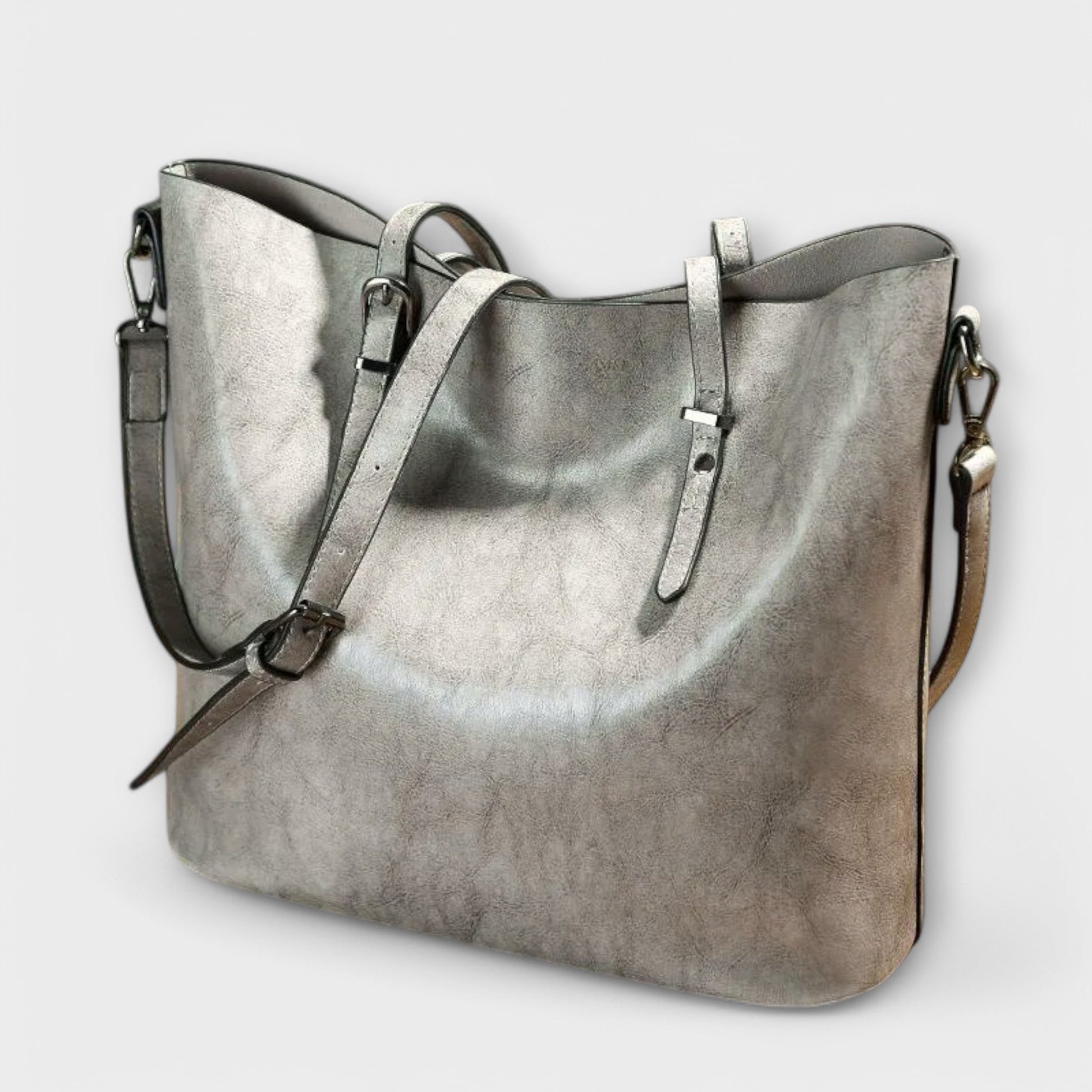 Alruna™ black shoulder bag with clean design, adjustable straps, and spacious compartment