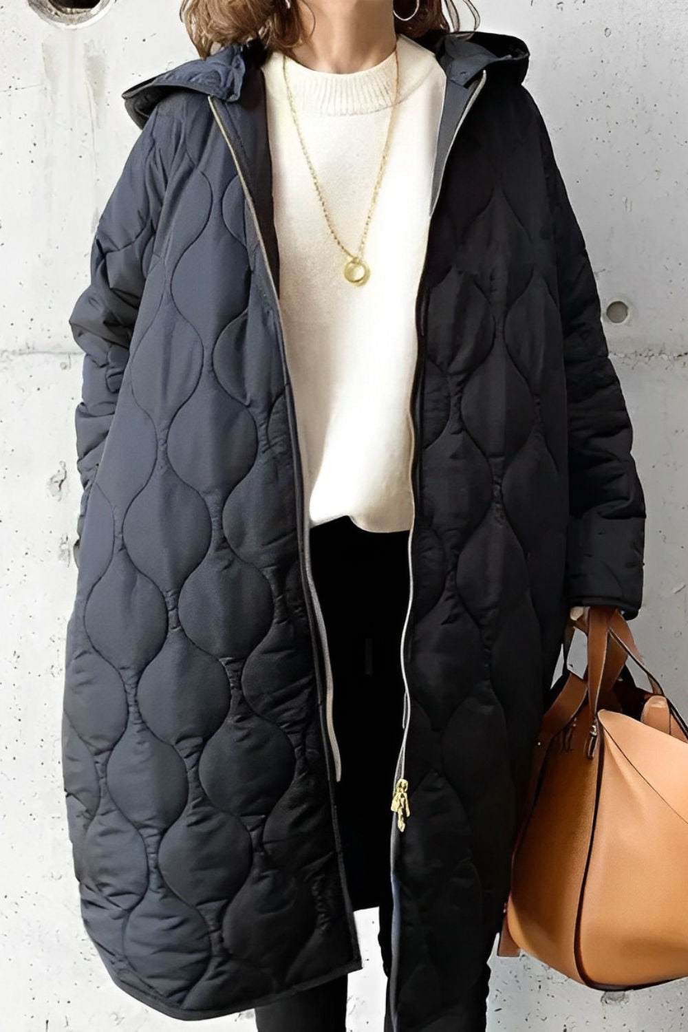 Women's oversized quilted parka coat, hooded knee-length design with bubble texture detailing