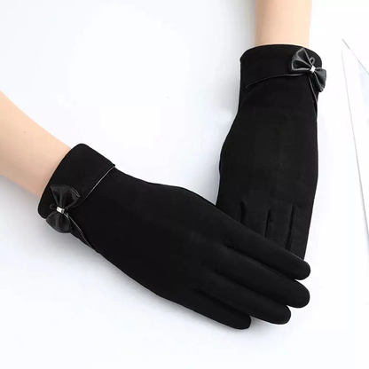 Black winter gloves with elegant bow detail, thick split-finger design, touchscreen-compatible fingertips