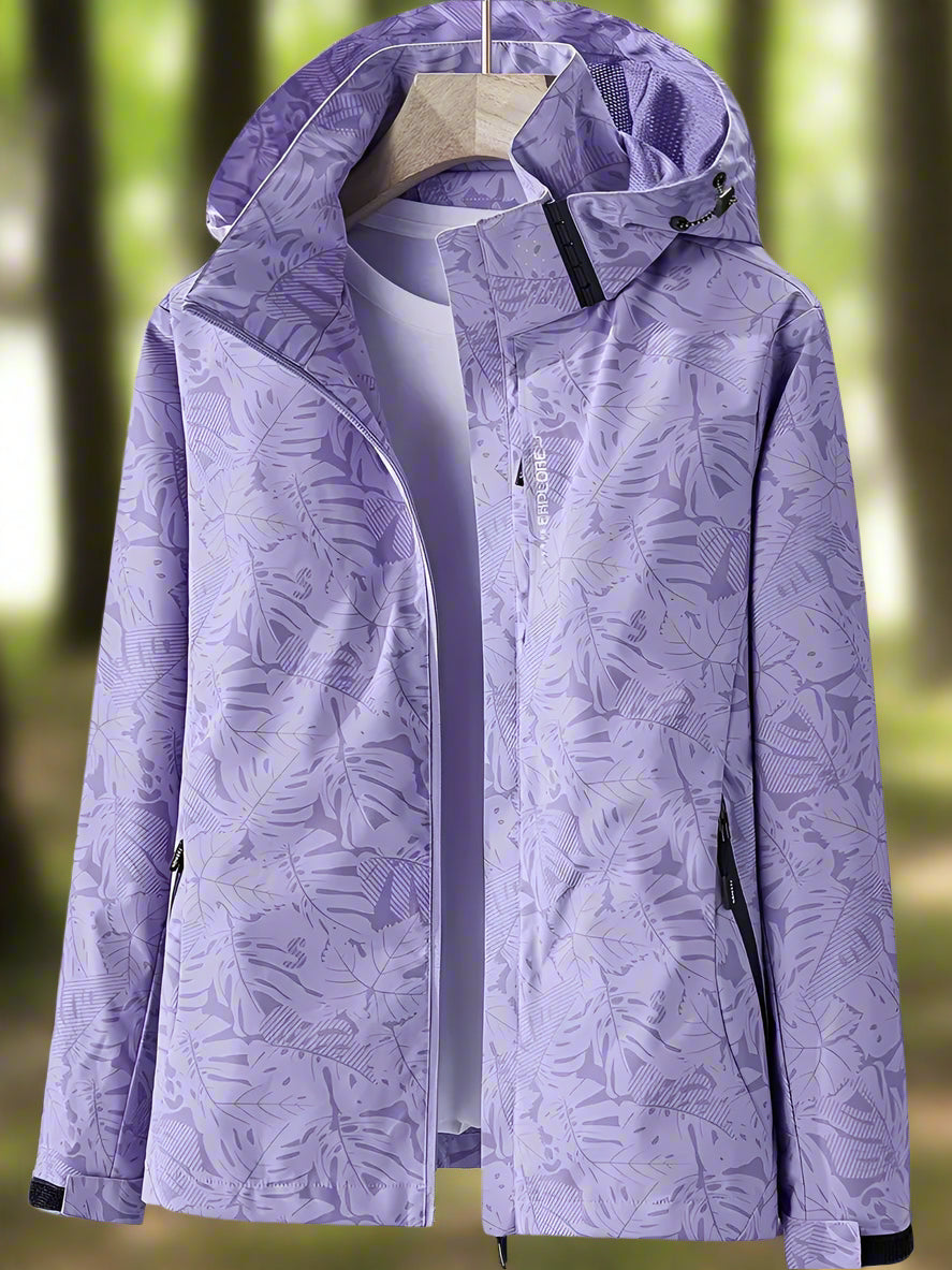 Women's lightweight waterproof summer jacket in bold leaf pattern with adjustable fit