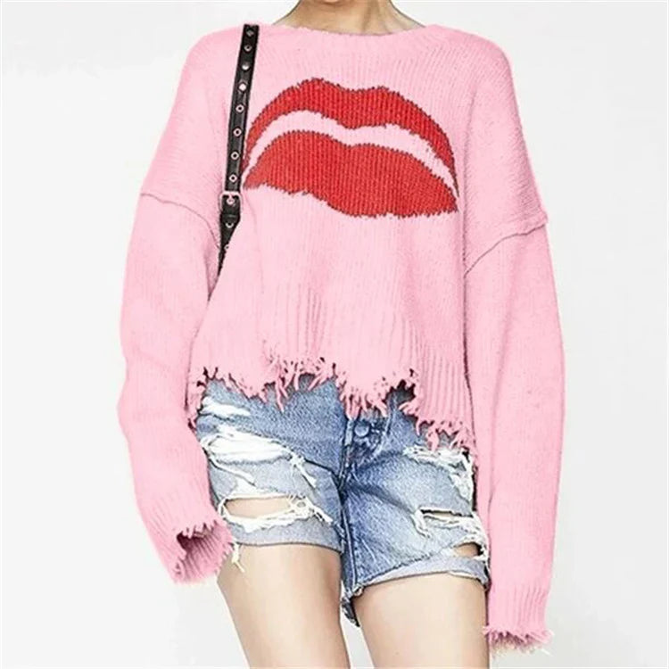 Women's chunky knit wool oversized cropped sweater with lip motif and fringed hem in cozy warmth
