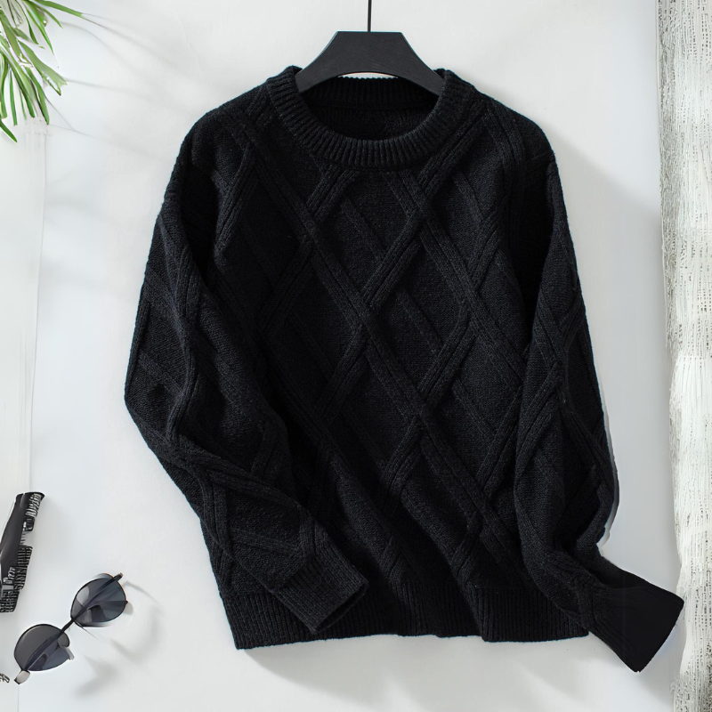 Ivory diamond knit sweater with round neckline, ribbed trims, and intricate light-catching texture