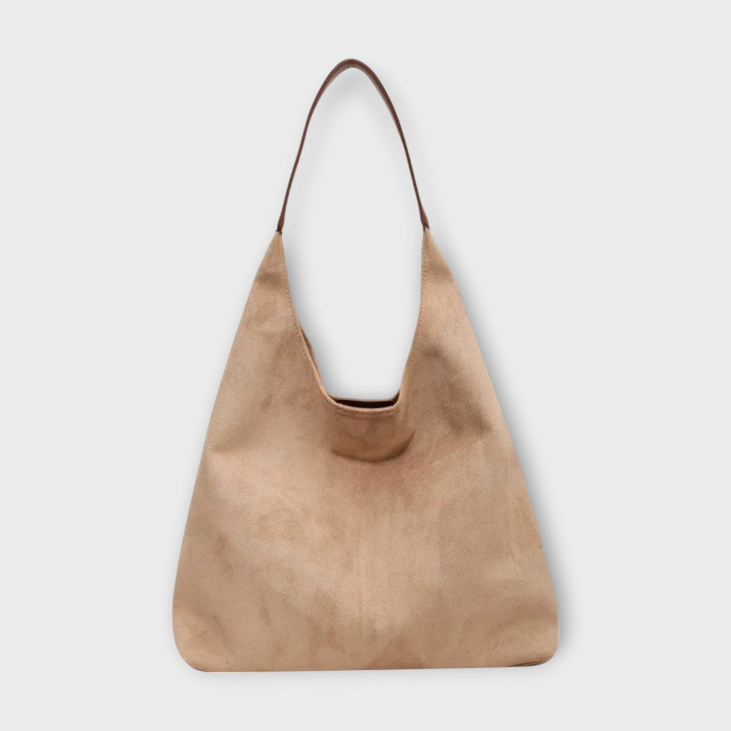Minimalist beige shoulder bag with clean lines, simple strap, and timeless elegant silhouette