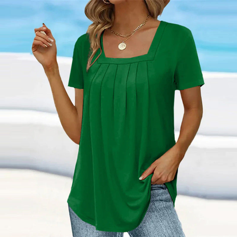 Elegant white pleated blouse with soft front pleats, relaxed silhouette, timeless chic style
