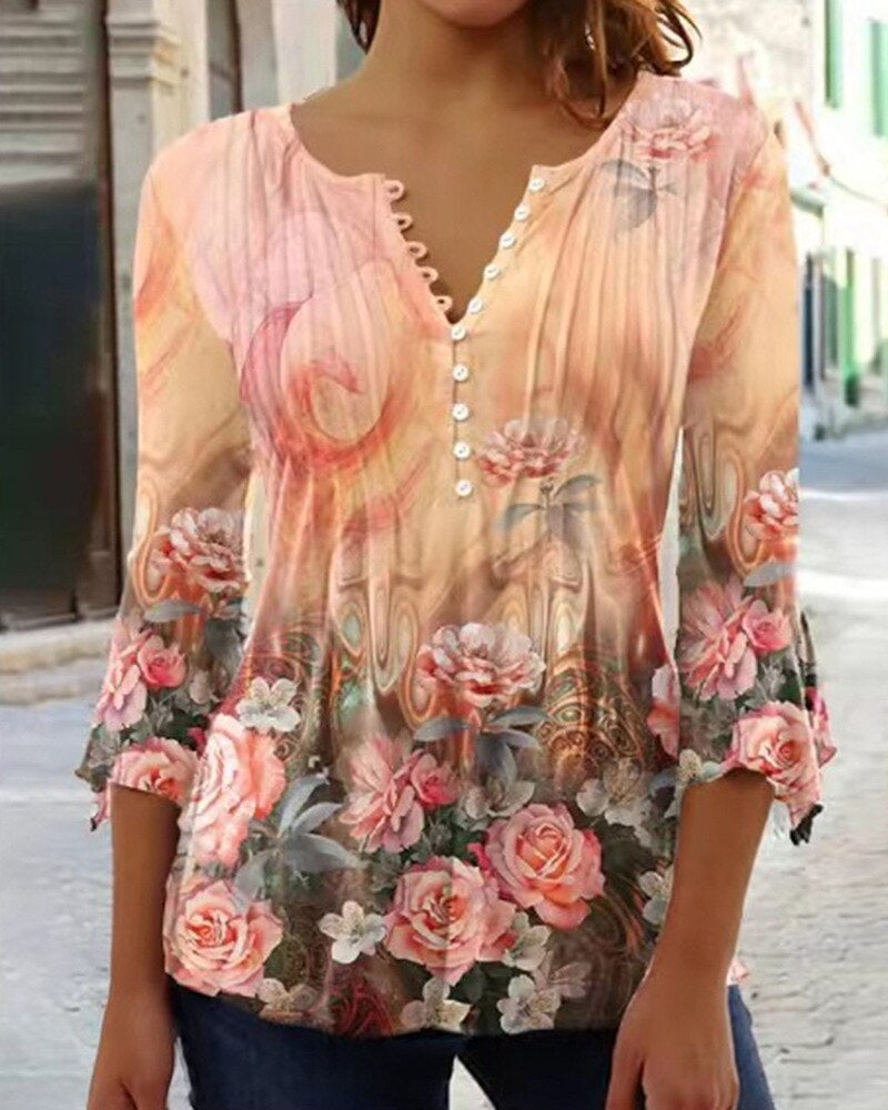 Floral women's blouse with scalloped neckline, flowing pleats, soft feminine everyday elegance style
