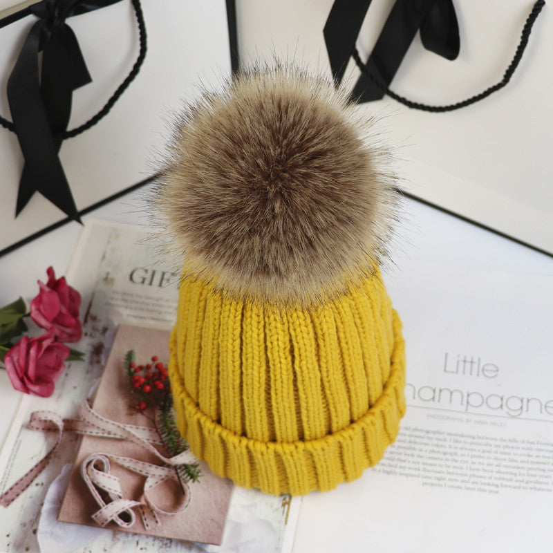 Cozy classic knit beanie with fluffy pom-pom accent, snug feminine winter hat in neutral tone
