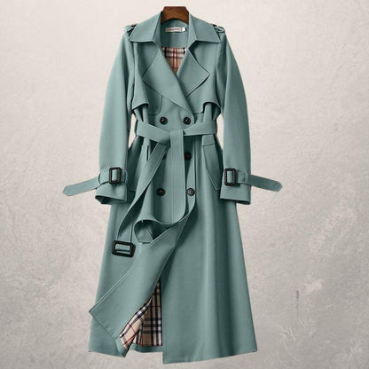 Elegant double-breasted trench coat with adjustable belt, cross-front closure, and cozy lining