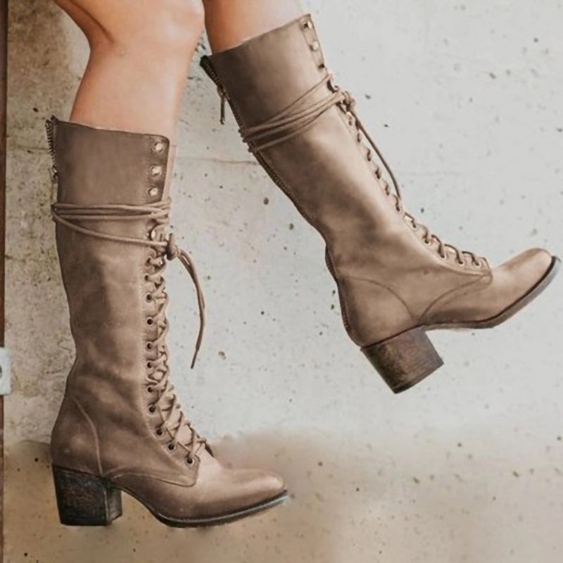 Women's black leather knee-high boots with block heel and lace-up front closure for fall