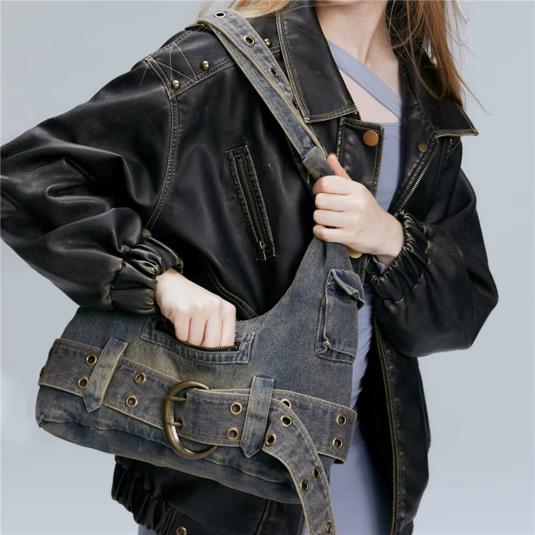Ashen charcoal denim shoulder tote bag vintage rebel style with intentional fraying and multiple pockets