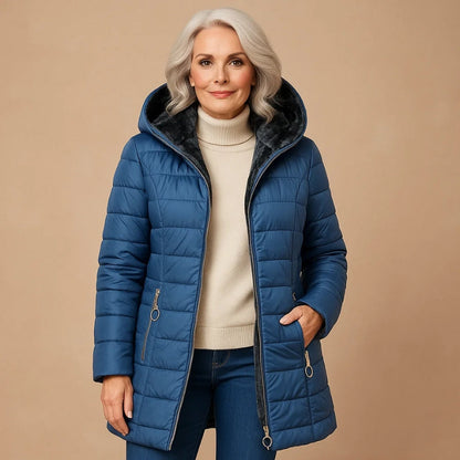 Nuvra oversized winter jacket with plush-lined hood, sculpted cold-shield shell, bulk-free warm fit