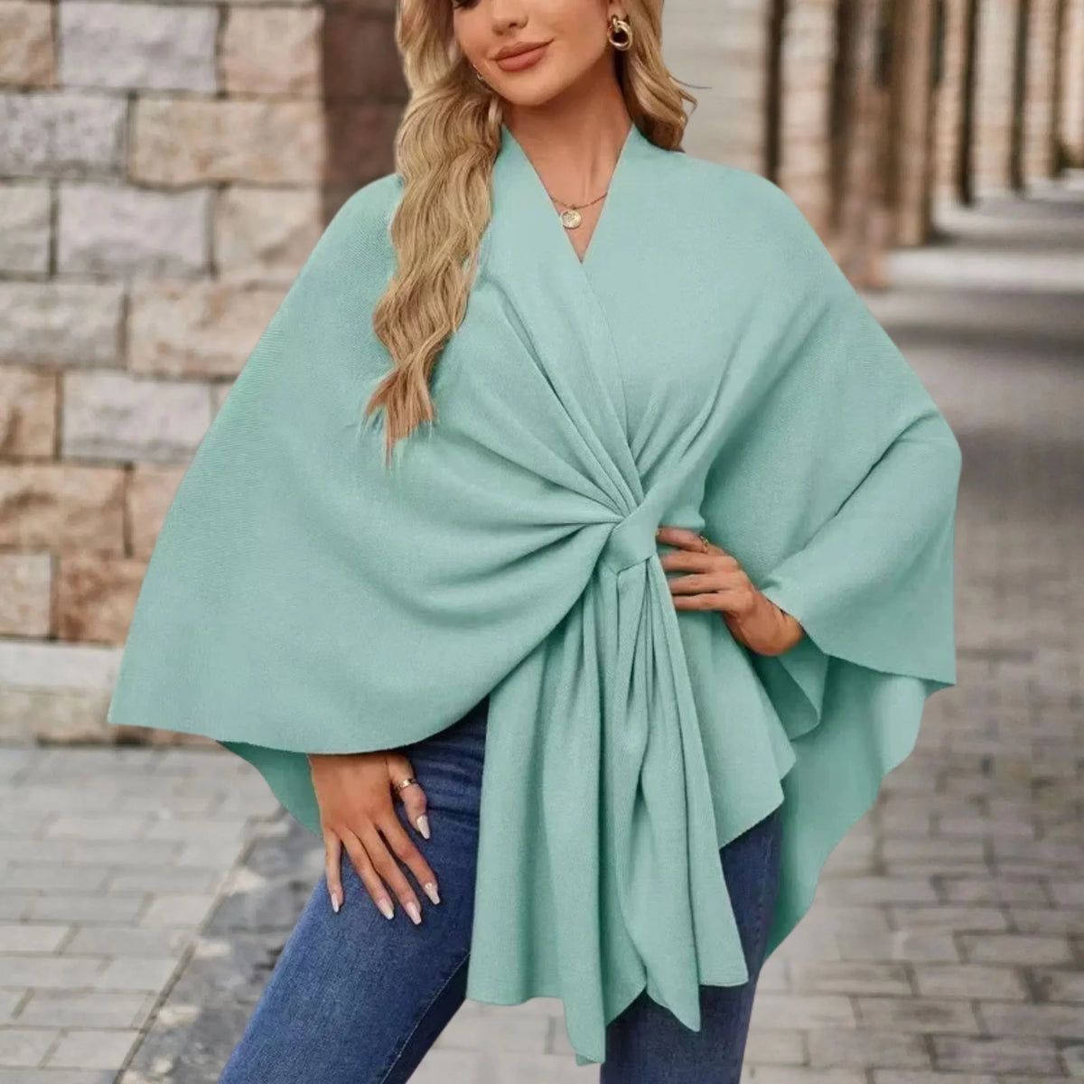 Elegant draped poncho with chic front knot, flowing silhouette, soft cozy fabric for casual refined style