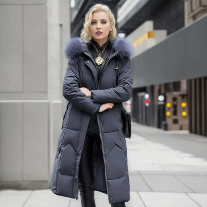 Women's long quilted winter coat with hood trim, flattering silhouette, cozy warmth