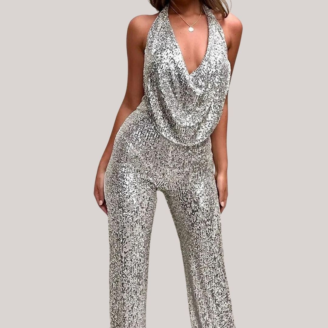 Women's silver sequin halter jumpsuit with flowing silhouette and all-over shimmer for glam nights