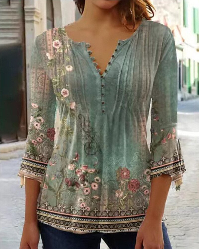 Floral women's blouse with scalloped neckline, flowing pleats, soft feminine everyday elegance