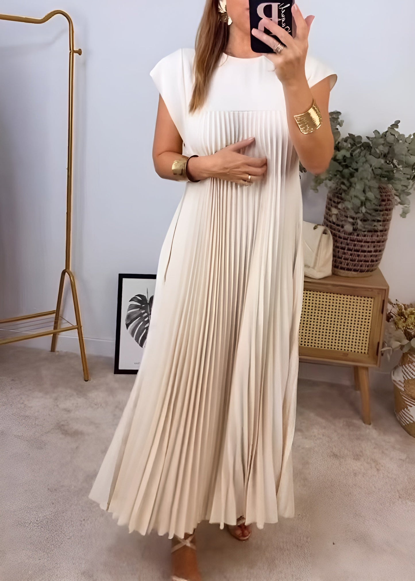 Women's elegant pleated evening dress with graceful silhouette and flowing soft-textured fabric