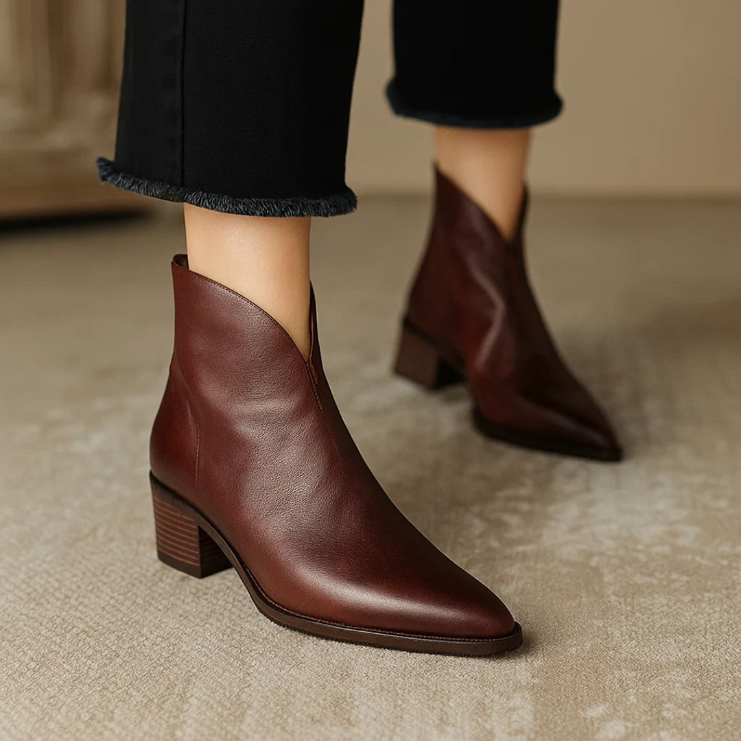 Black leather ankle boots sleek silhouette premium soft finish versatile luxury footwear