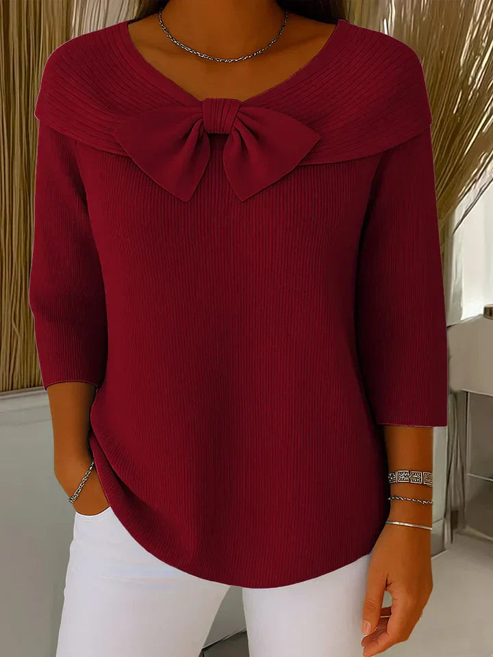 Women's round neckline sweater with delicate bow accent, soft breathable fabric, feminine elegant style