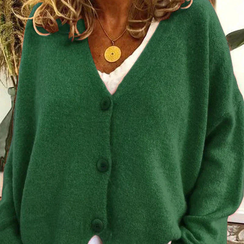 Women's loose fit v-neck knit cardigan in cozy fabric with classic button-front closure for effortless layering