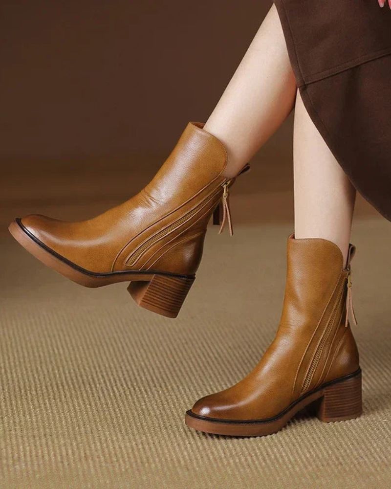 Black elegant ankle boots with sleek silhouette and cushioned comfort, perfect for casual to dressy wear