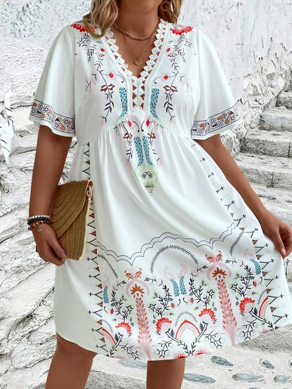 Plus size boho midi dress with floral geometric embroidery hem, relaxed silhouette, carefree wanderlust style