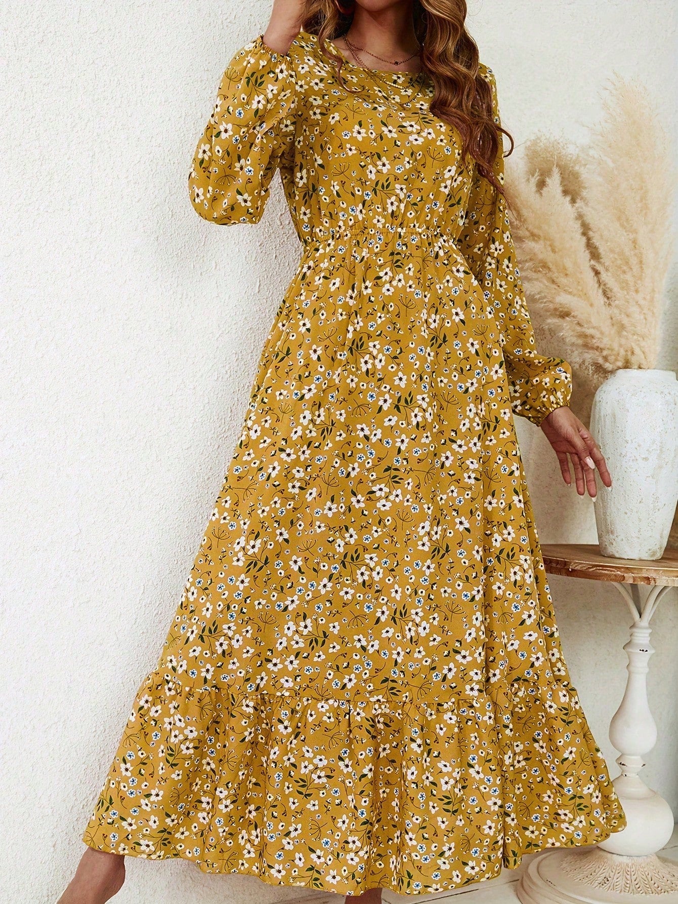 Women's floral print maxi dress with bishop sleeves, smocked waist, and flowing A-line silhouette