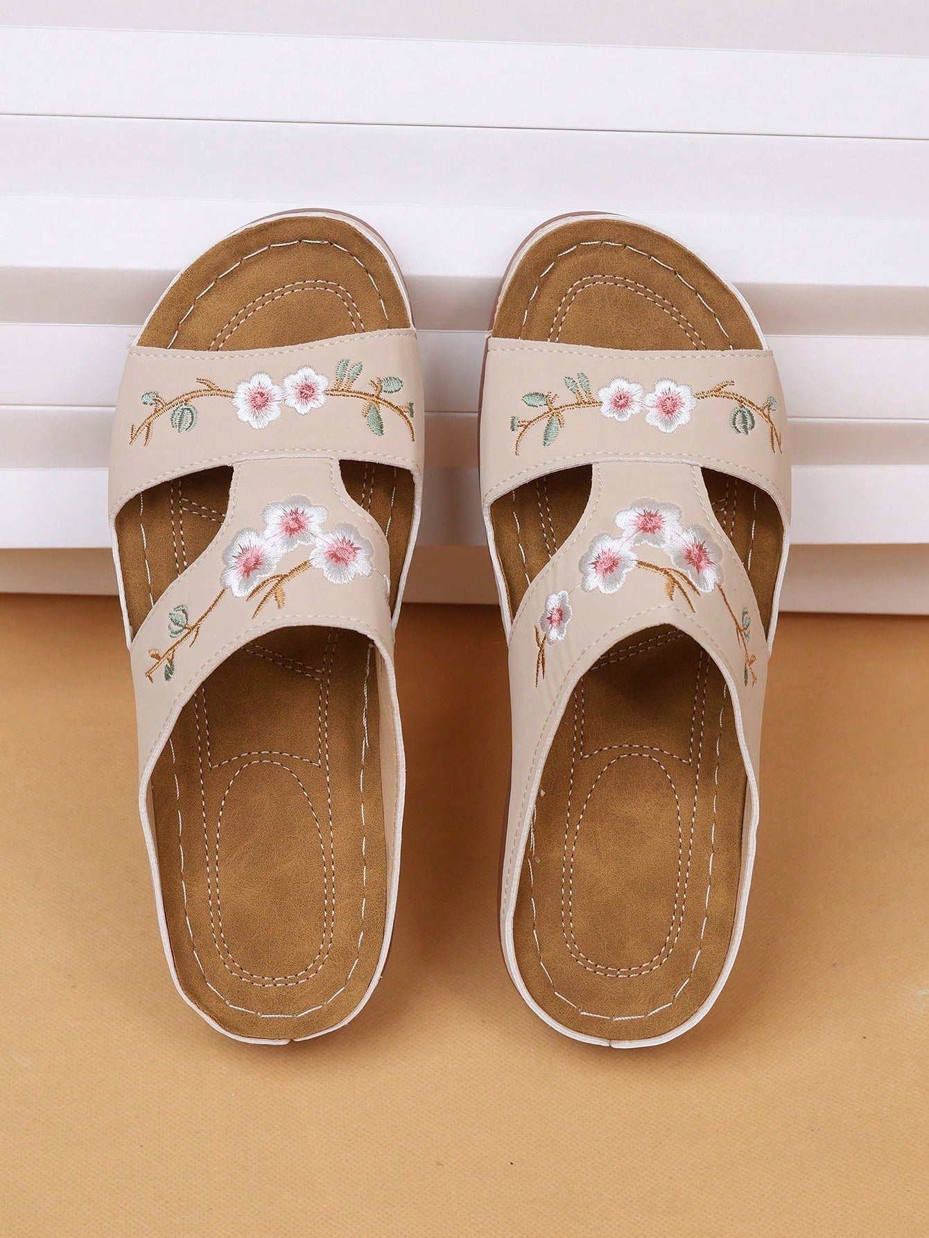 Floral embroidered platform sandals open-toe slip-on design with delicate blossom strap detail
