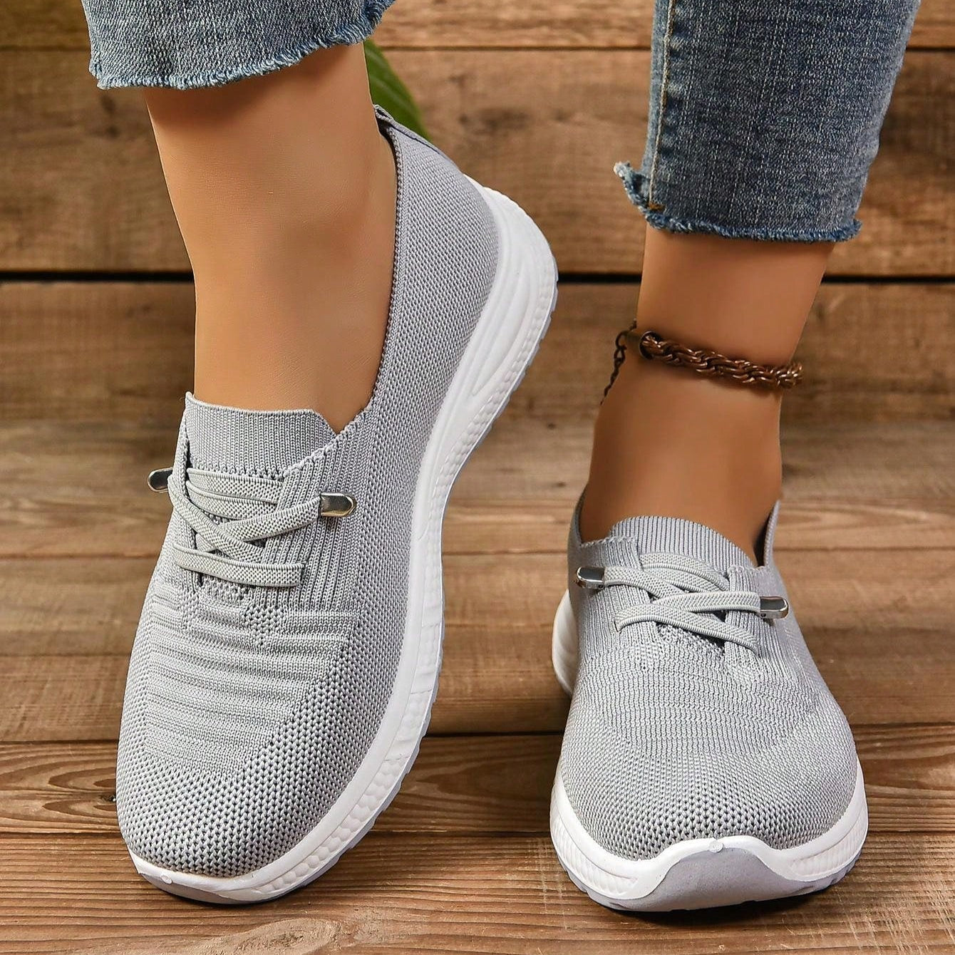 Women's slip-on knit low-top comfort walking shoes in neutral tone with breathable upper