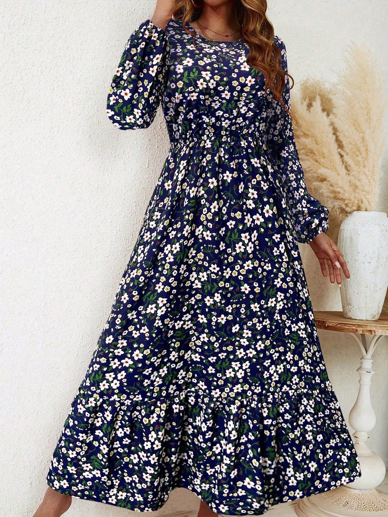 Women's floral print maxi dress with bishop sleeves, smocked waist, and flowing A-line silhouette