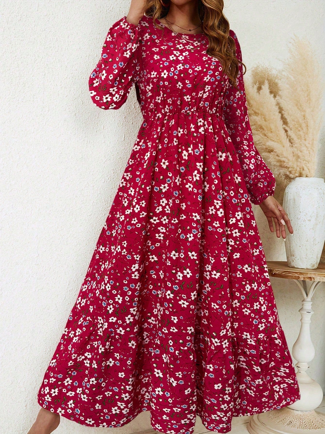 Women's floral print maxi dress with bishop sleeves, smocked waist, and flowing A-line silhouette
