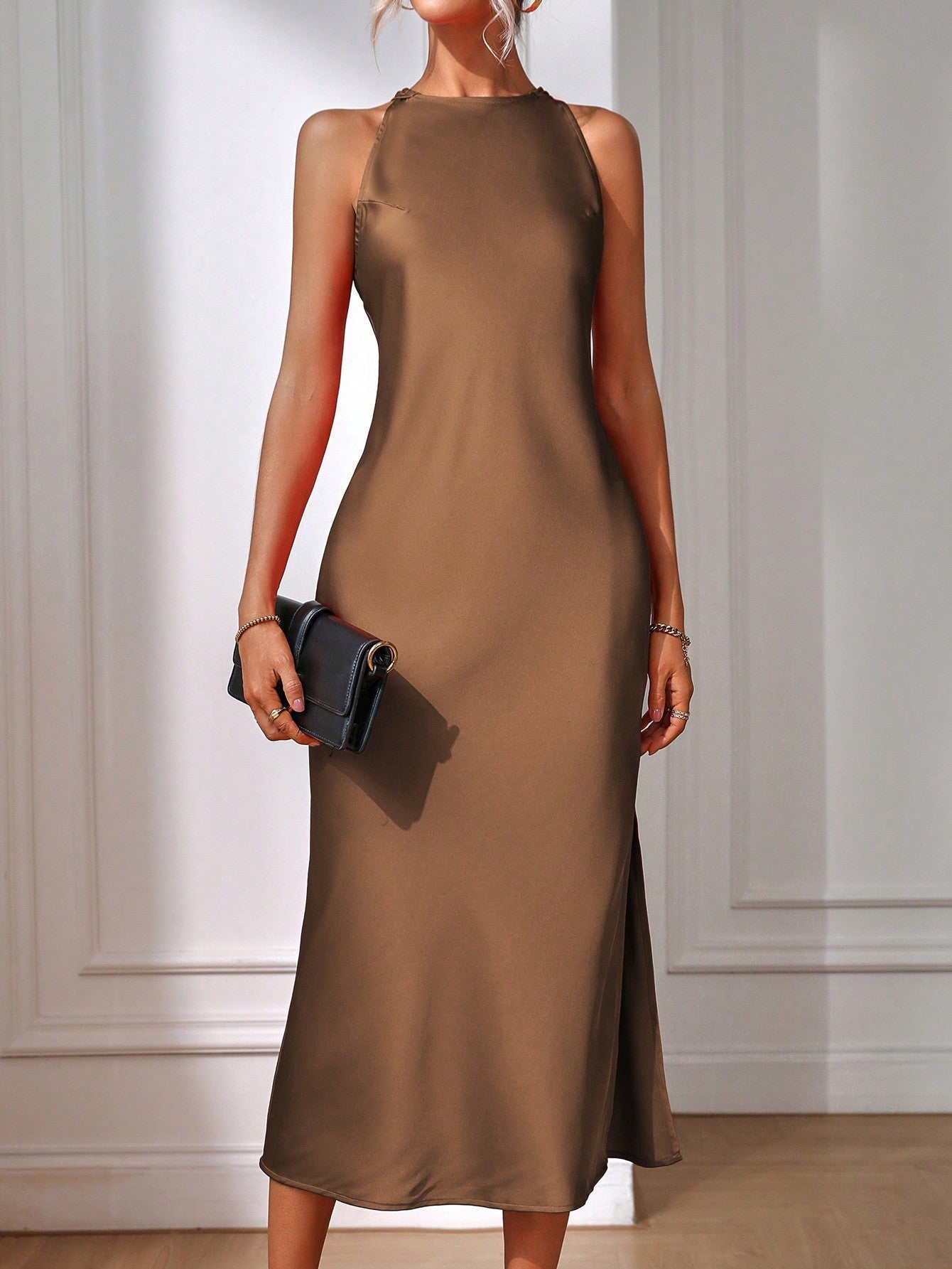 Brielle sleeveless maxi dress in elegant cut with architectural back and side cutouts for formal events