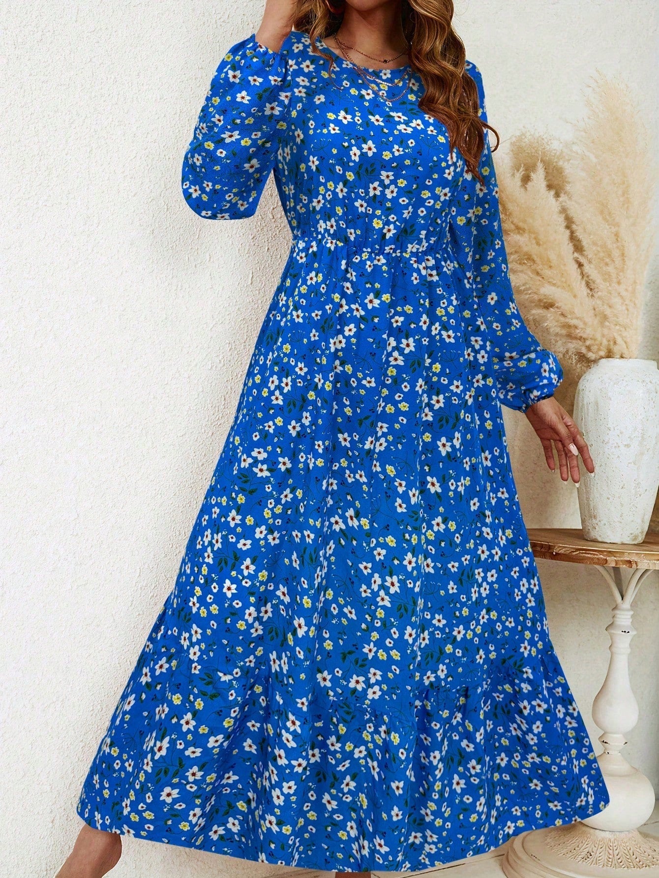Women's floral print maxi dress with bishop sleeves, smocked waist, and flowing A-line silhouette
