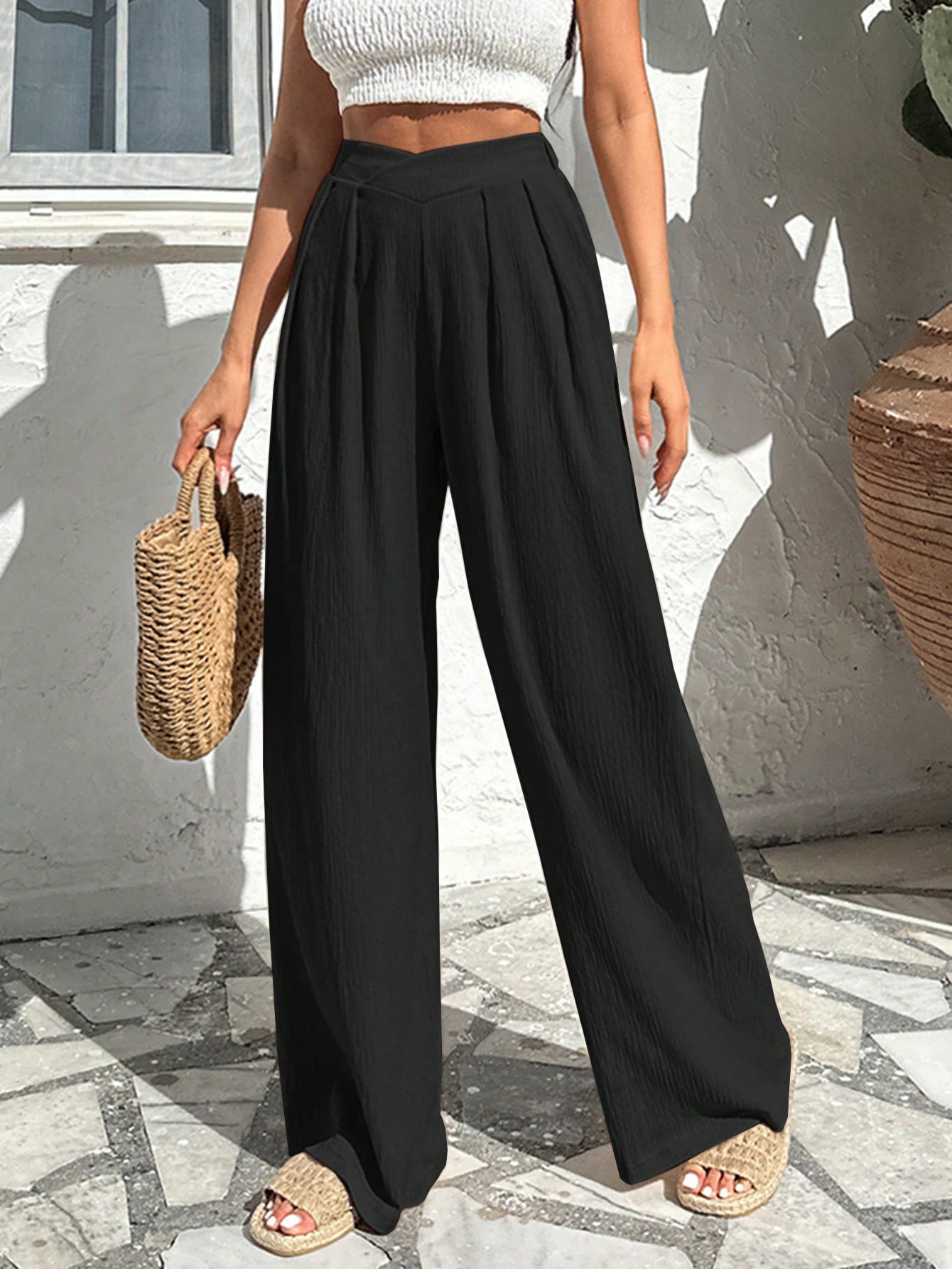 Wide-leg pleated high-rise trousers in soft stretch knit for a breathable, clean silhouette