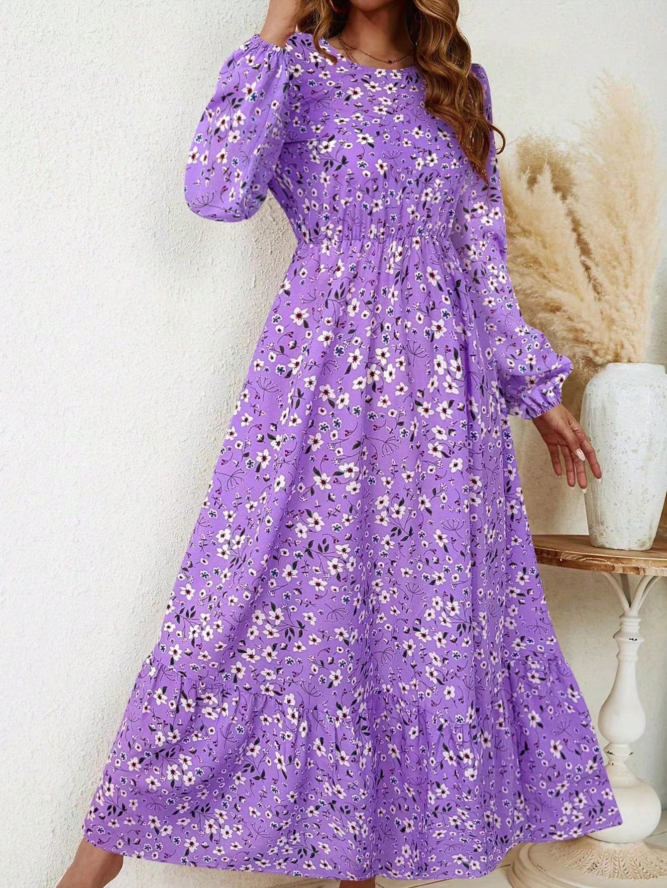 Women's floral print maxi dress with bishop sleeves, smocked waist, and flowing A-line silhouette