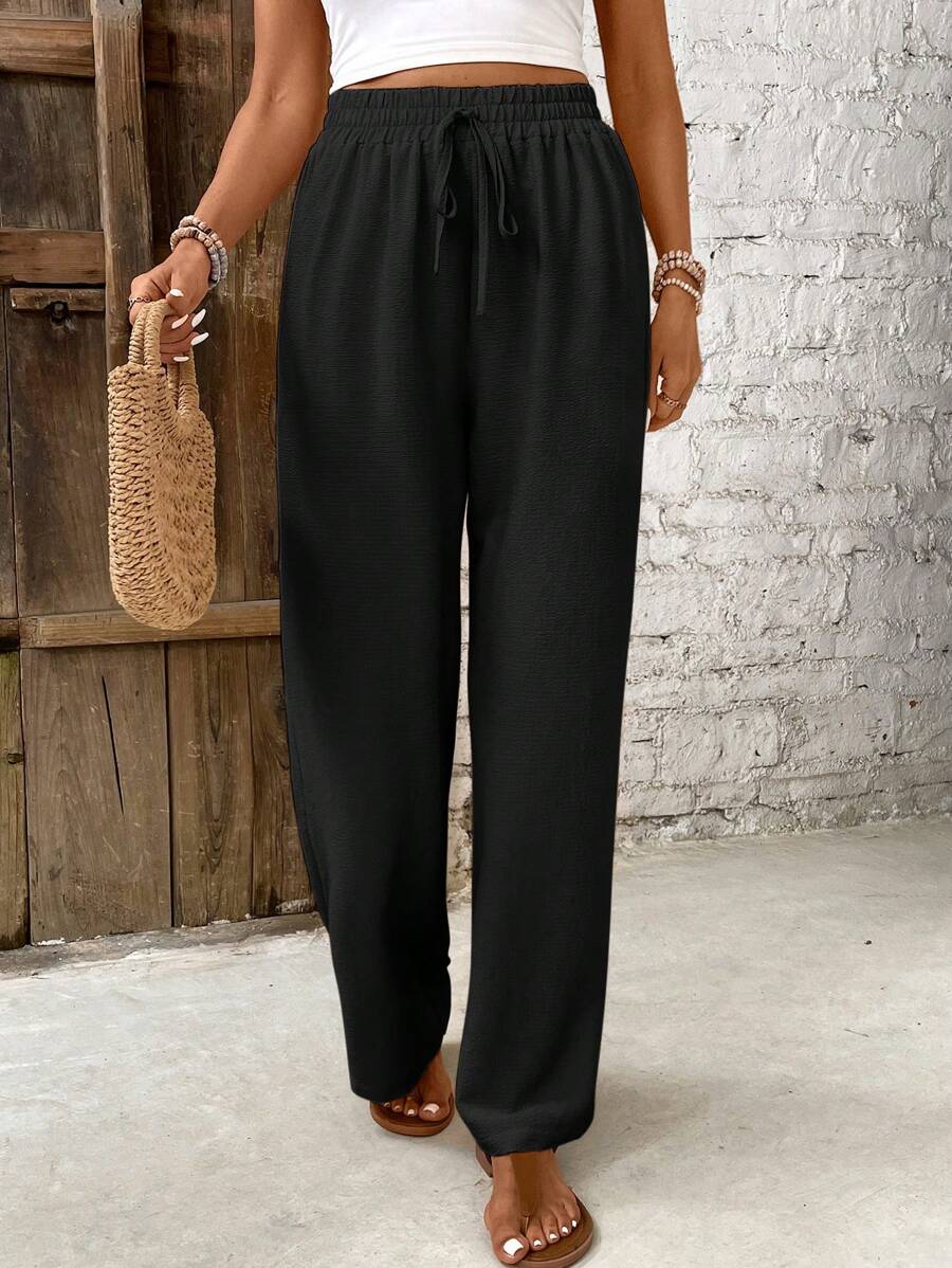 Skylar white high-waist lounge pants with button accents, relaxed airy silhouette for warm weather