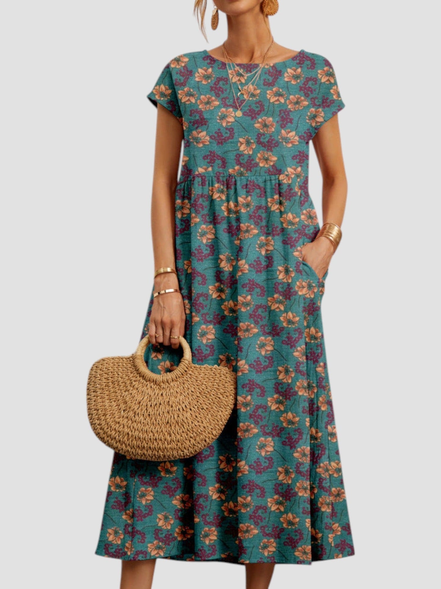 Vintage floral maxi dress with soft feminine silhouette and flowing tiered skirt in muted tones