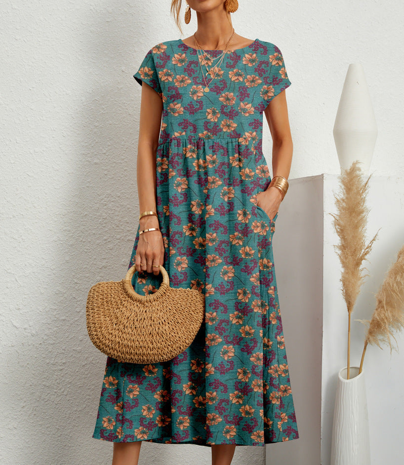 Elegant floral midi dress in soft tones, relaxed flared silhouette with feminine all-day comfort