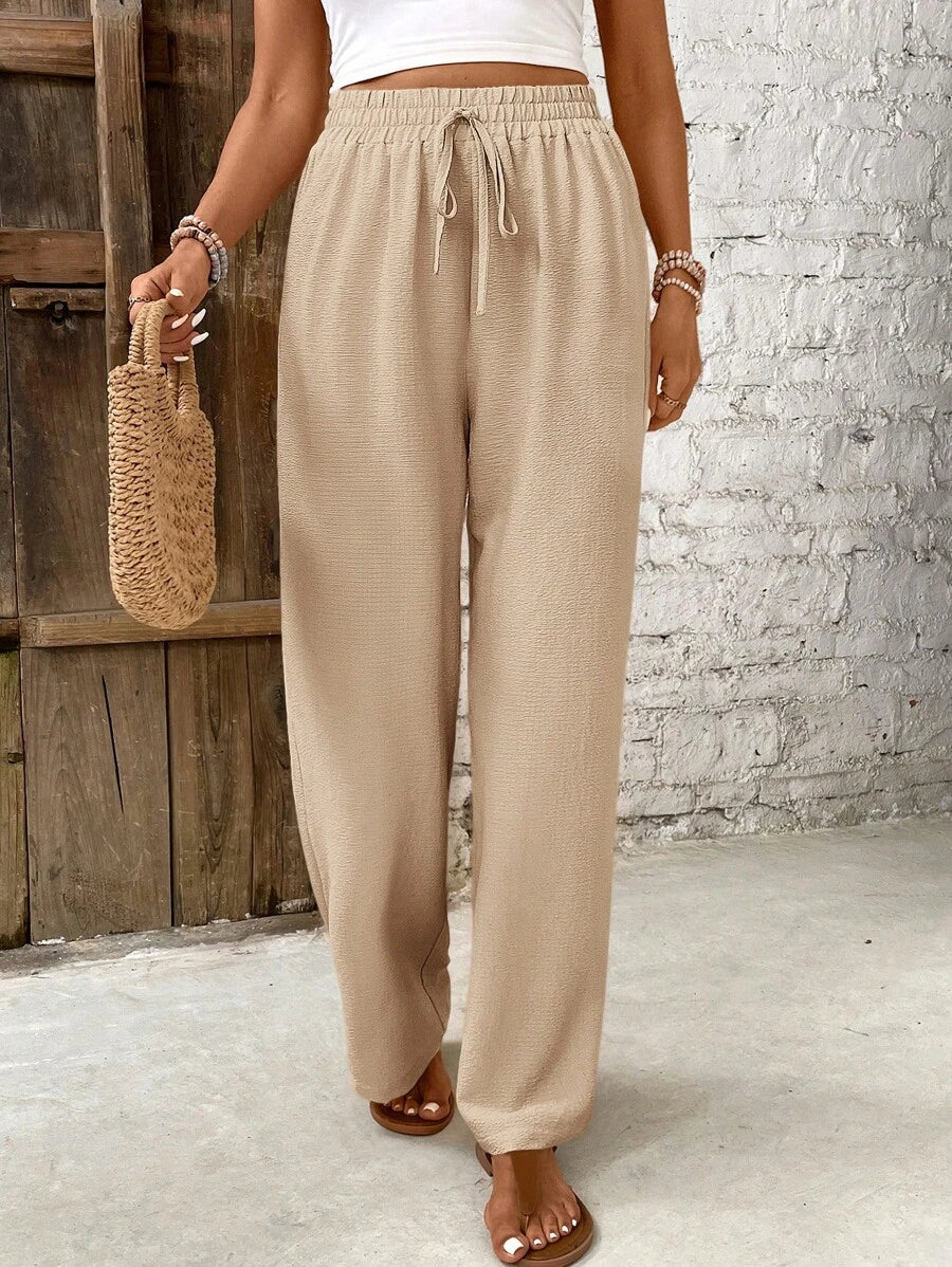 Skylar cream high-waist lounge pants with button accents, relaxed minimalist silhouette for women