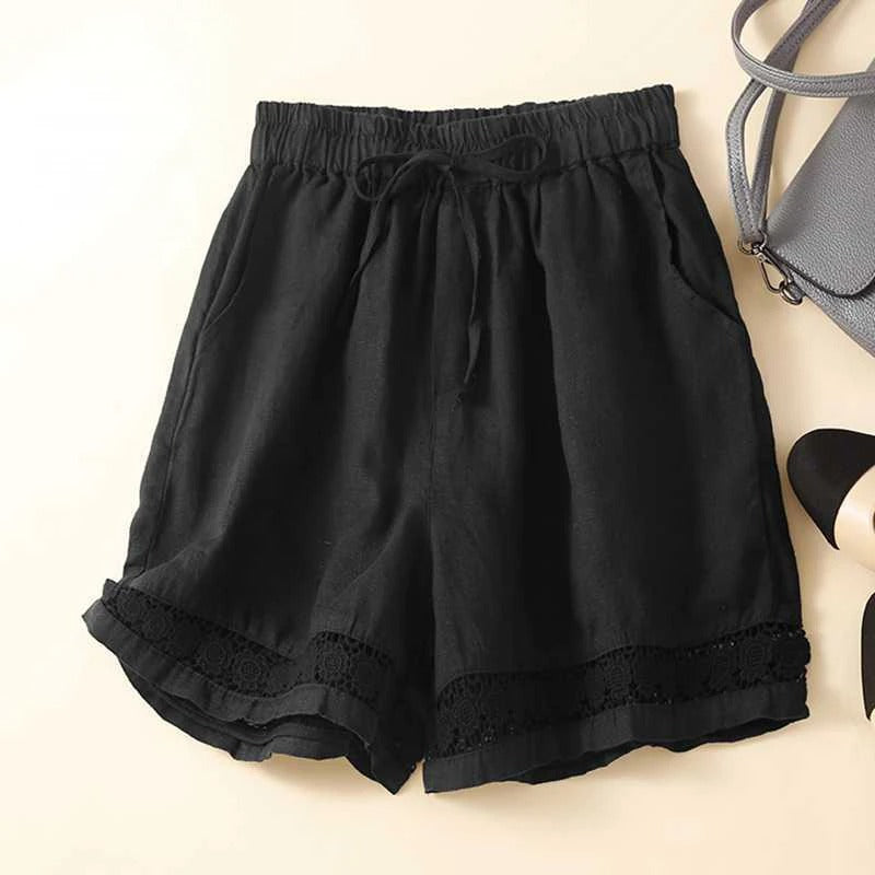 Relaxed floral shorts with soft waistband, roomy fit, and subtle embroidered trim for women