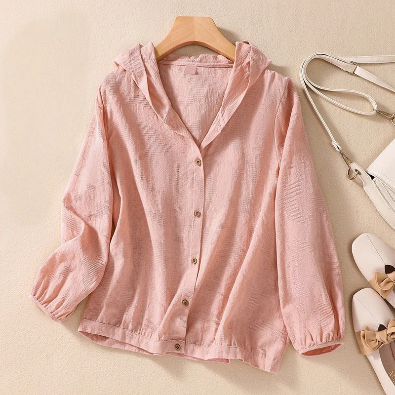 Relaxed hooded shirt in soft neutral tones with clean lines and a gently shaped hood for warm-weather layering