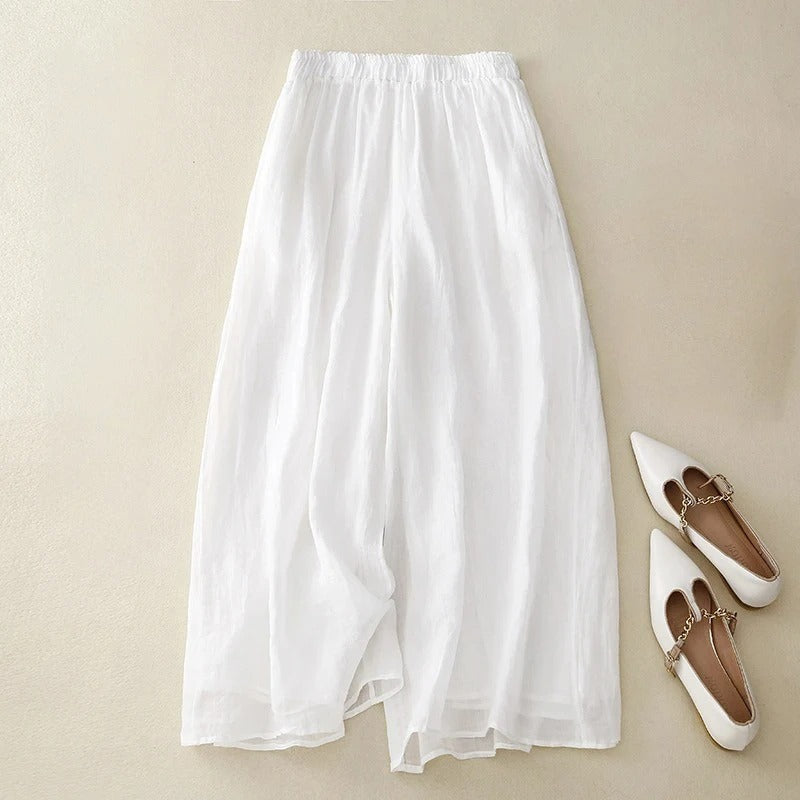 Elegant loose waistband pants in soft neutral tones, flowy silhouette with breathable fabric for warm days